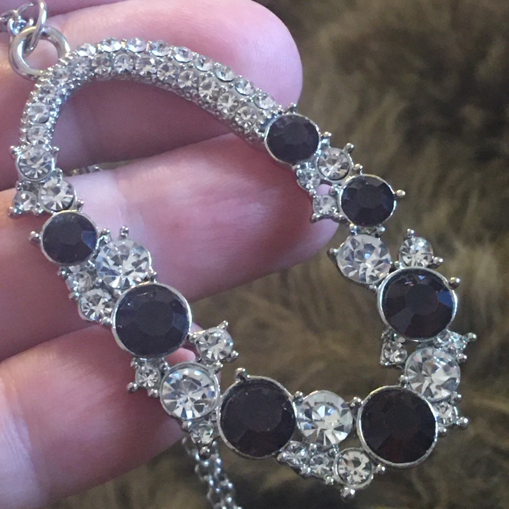 Deep purple stone covered amulet on chain necklace